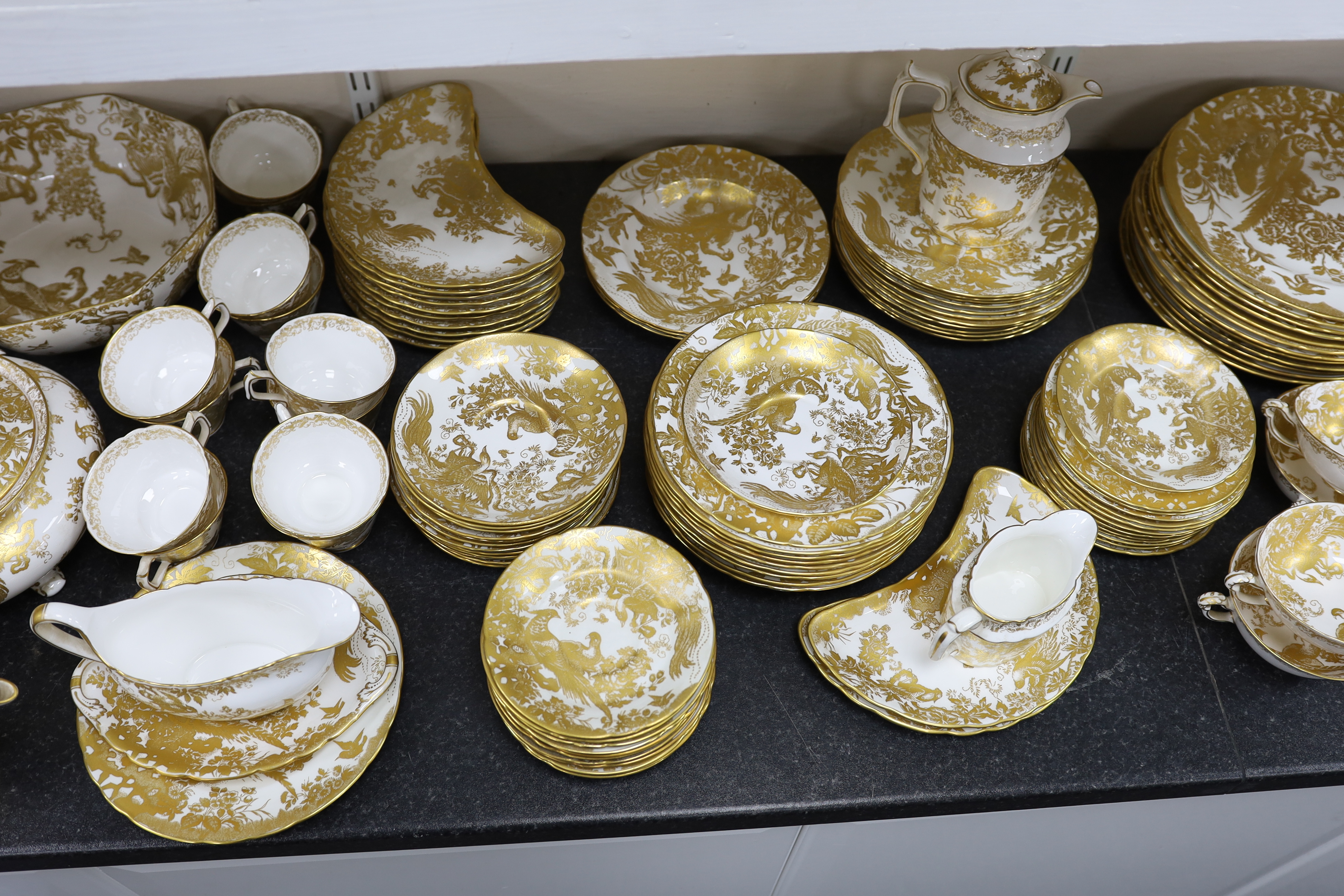 An extensive Royal Crown Derby Gold Aves dinner and tea service